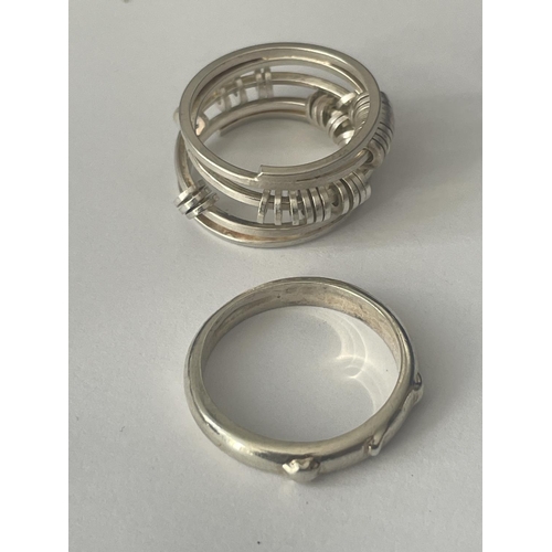 521 - FOUR ASSORTED SILVER RINGS