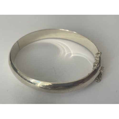 524 - TWO SILVER BANGLES