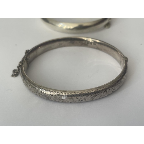 524 - TWO SILVER BANGLES