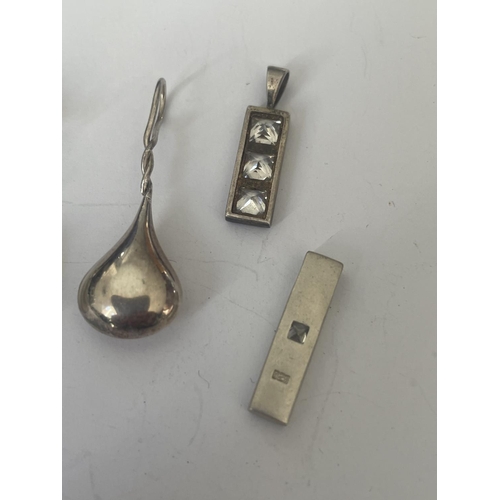 555 - A BAG OF SILVER PENDANTS