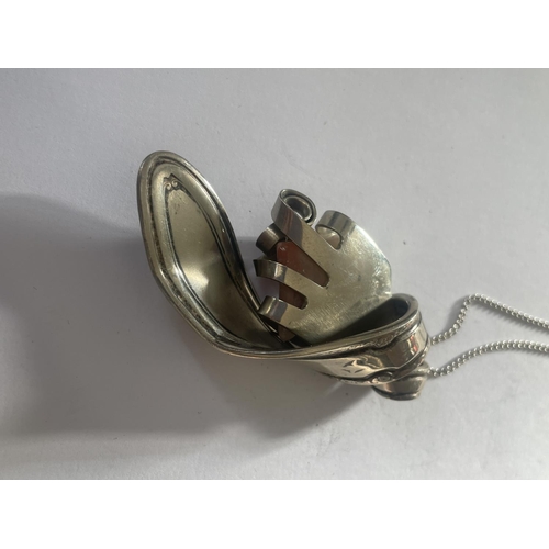 571 - AN ORNATE WHITE METAL SPOON AND AGATE PENDANT