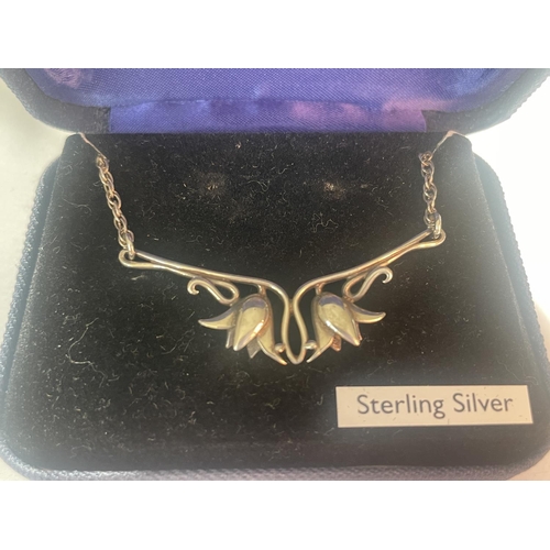 572 - A BOXED SILVER TULIP NECKLACE