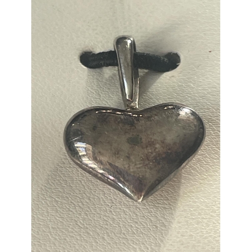 606 - A BOXED SILVER HEART