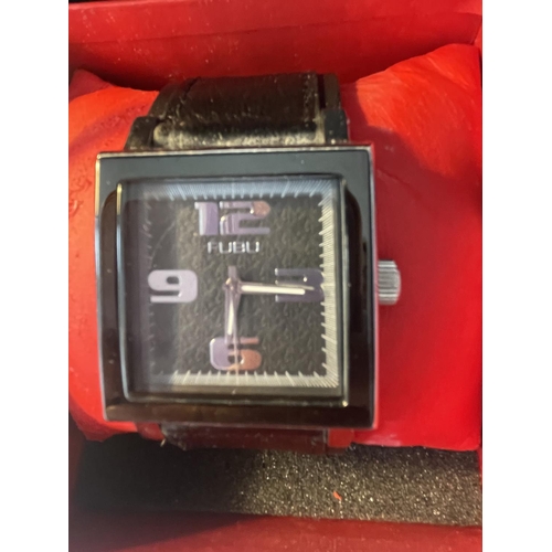 611 - AN AS NEW AND BOXED FUBU WRISTWATCH SEEN WORKING BUT NO WARRANTY