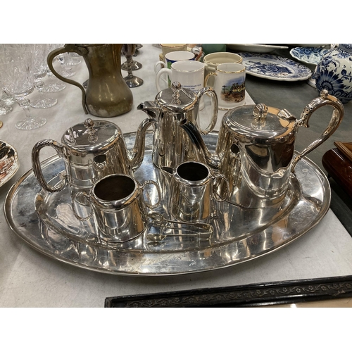 251 - A VINTAGE SILVER PLATED TEA SET AND TRAY