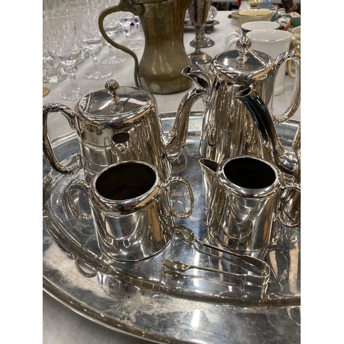 251 - A VINTAGE SILVER PLATED TEA SET AND TRAY