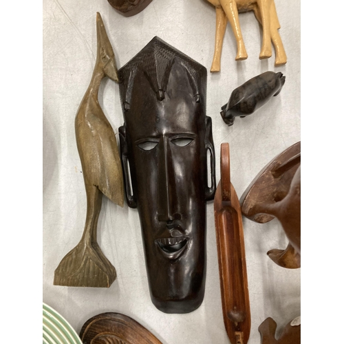 268 - A COLLECTION OF TREEN TRIBAL WOODEN ITEMS, ELEPHANTS, MASK ETC