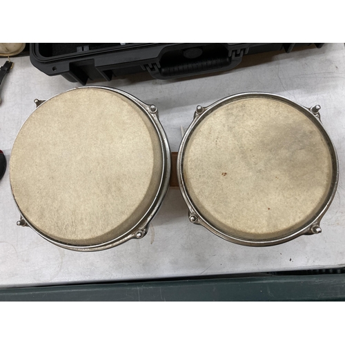 299 - A PAIR OF WOODEN BONGO DRUMS