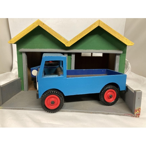 353 - A WOODEN GARAGE HOUSING A WOODEN LANDROVER AND A WOODEN LORRY