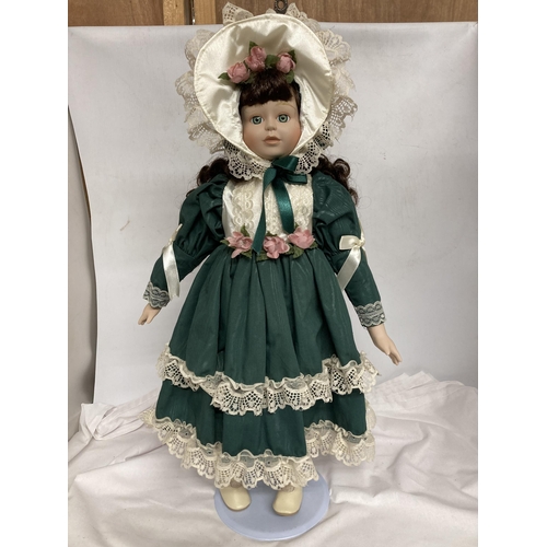 379 - A COLLECTION OF PORCELAIN HEADED DOLLS IN CSTUMES - 4 IN TOTAL