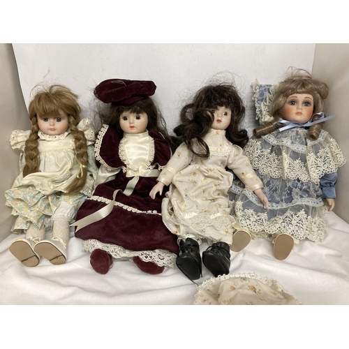 380 - A COLLECTION OF PORCELAIN HEADED DOLLS IN COSTUMES - 7 IN TOTAL