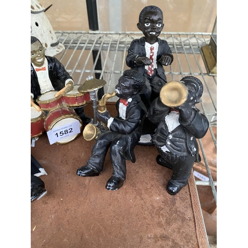 A SET OF SEVEN VINTAGE RESIN JAZZ BAND PLAYER FIGURES