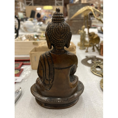 145 - A BRONZE TIBETAN HEALING BUDDAH