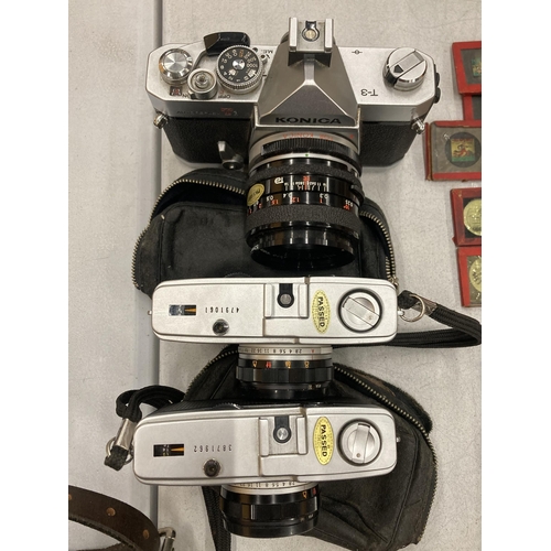 151 - THREE VINTAGE CAMERAS TO INCLUDE TWO OLYMPUS TRIP 35'S PLUS A KONICA AUTOREFLEX T3