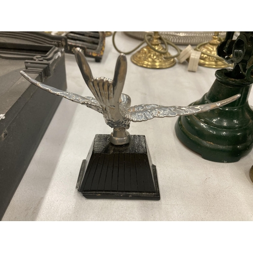 156 - A VINTAGE WHITE METAL MODEL OF A SWIFT CAR MASCOT ON A BASE, HEIGHT 14CM