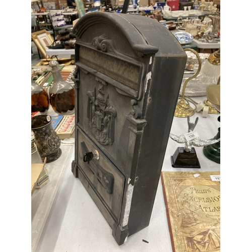 159 - A BLACK METAL WALL MOUNTED LETTER BOX WITH COAT OF ARMS AND KEY