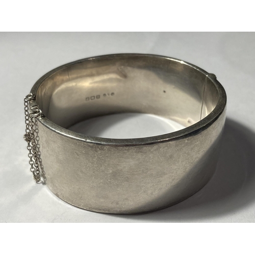 641 - A HALLMARKED BIRMINGHAM HEAVY SILVER BANGLE