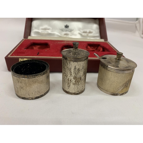 1 - A CASED BIRMINGHAM HALLMARKED SILVER THREE PIECE CONDIMENT SET COMPRISING PEPPERETTE, OPEN SALT AND ... 