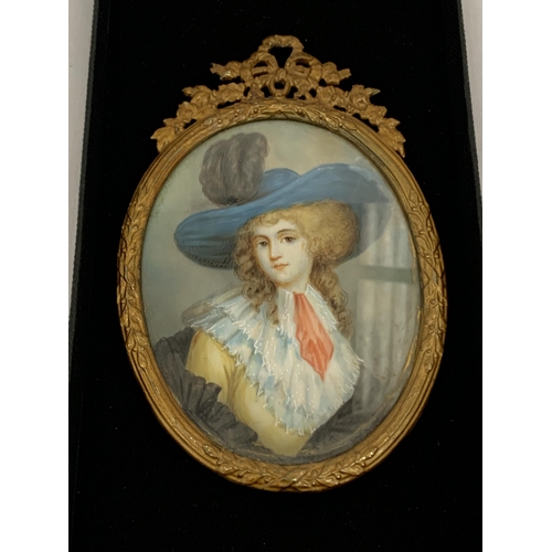 20 - AN ANTIQUE (APPROX 1870) GILT FRAMED PORTRAIT MINIATURE OF A LADY, LABEL TO REVERSE, LENGTH 11CM