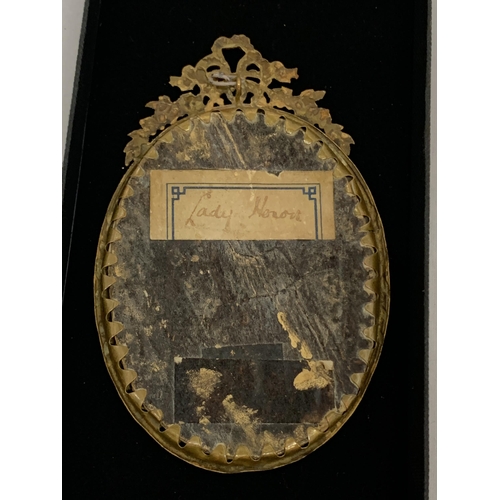 20 - AN ANTIQUE (APPROX 1870) GILT FRAMED PORTRAIT MINIATURE OF A LADY, LABEL TO REVERSE, LENGTH 11CM