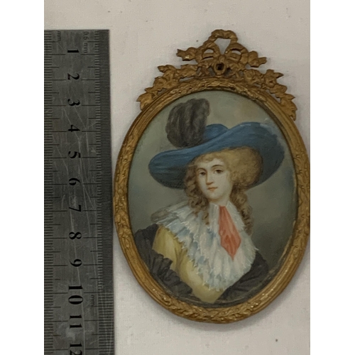 20 - AN ANTIQUE (APPROX 1870) GILT FRAMED PORTRAIT MINIATURE OF A LADY, LABEL TO REVERSE, LENGTH 11CM