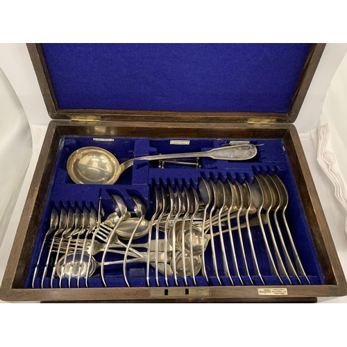 29 - A VINTAGE OAK CASED WALKER AND HALL SILVER PLATED CANTEEN OF CUTLERY