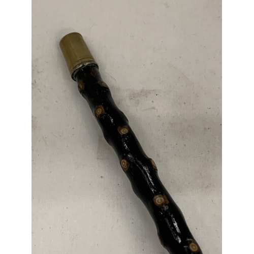 30 - A VINTAGE EBONISED WALKING STICK WITH HORN EFFECT BIRD TOP WITH JEWELLED DESIGN EYES