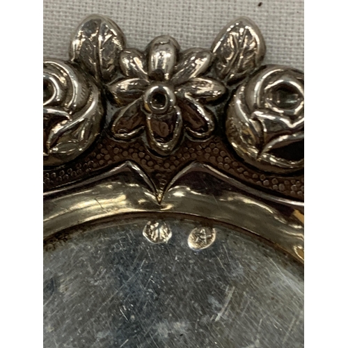 38 - A CONTINENTAL SILVER FLORAL DESIGN DISH