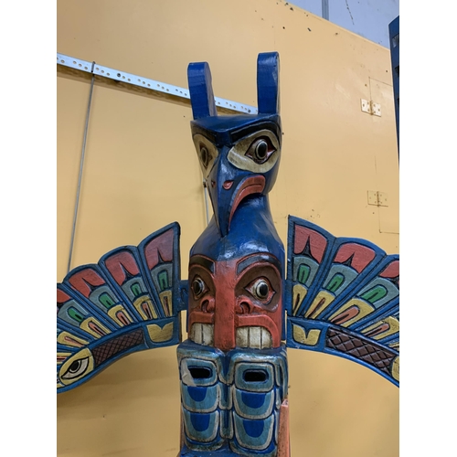 73 - A LARGE WOODEN TOTEM POLE FIGURE