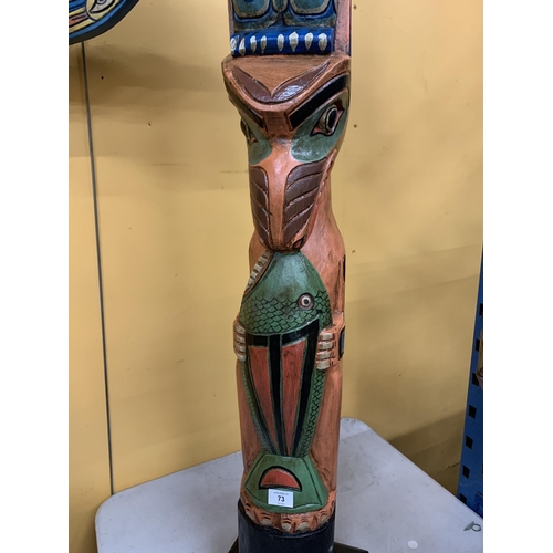 73 - A LARGE WOODEN TOTEM POLE FIGURE