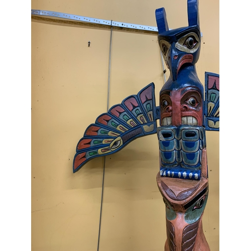 73 - A LARGE WOODEN TOTEM POLE FIGURE