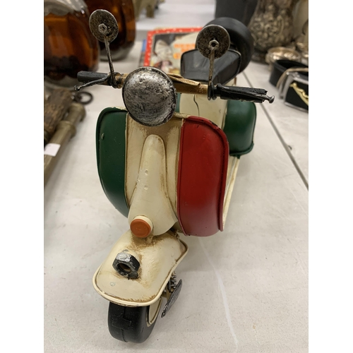 174 - AN ITALIAN TIN PLATE SCOOTER WITH A COLOUR BOOK OF SCOOTERS