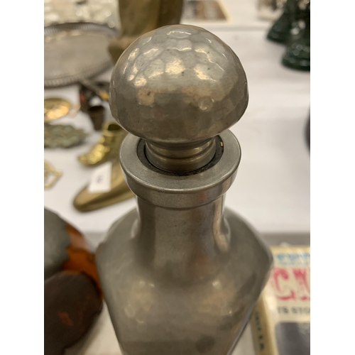 175 - A PAIR OF DUTCH AMBER COLOURED THREE SIDED DECANTERS WITH PEWTER BASE AND TOP, HEIGHT 25CM