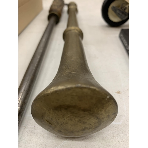 176 - A LARGE BRASS PESTLE AND A HORN HANDLED SHARPENER