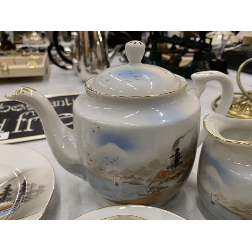 183 - AN ORIENTAL TEASET TO INCLUDE A TEAPOT, CREAM JUG, CUPS, SAUCERS AND PLATES