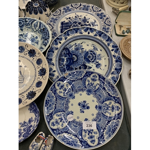 236 - A LARGE QUANTITY OF BLUE AND WHITE CERAMICS TO INCLUDE FISH TILES, SOUP COUPES, JELLY MOULDS, PLATES... 