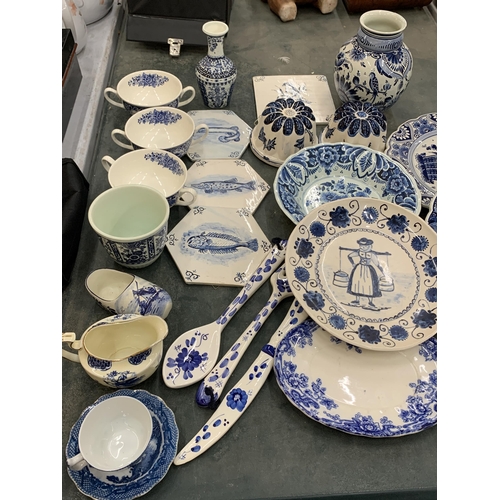 236 - A LARGE QUANTITY OF BLUE AND WHITE CERAMICS TO INCLUDE FISH TILES, SOUP COUPES, JELLY MOULDS, PLATES... 