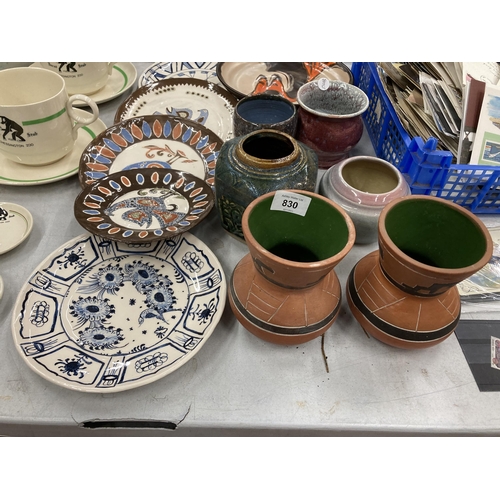 830 - A LARGE QUANTITY OF STUDIO POTTERY TO INCLUDE VASES, PLATES AND PLANTERS, SOME SIGNED TO THE BASE