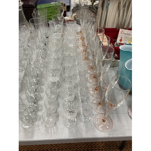 835 - A VERY LARGE QUANTITY OF GLASSES, SOME CUT GLASS, TO INCLUDE CHAMPAGNE FLUTES, WINE, SHERRY, PORT, B... 