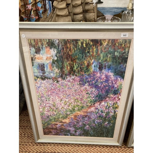 845 - A LARGE FRAMED CLAUDE MONET PRINT 'THE ARTIST'S GARDEN AT GIVERNY', 37CM X 99CM