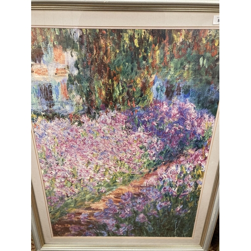 845 - A LARGE FRAMED CLAUDE MONET PRINT 'THE ARTIST'S GARDEN AT GIVERNY', 37CM X 99CM