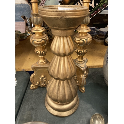 857 - THREE LARGE HEAVY ORNATE GOLD COLOURED CANDLESTICKS, HEIGHT 47CM AND 38CM