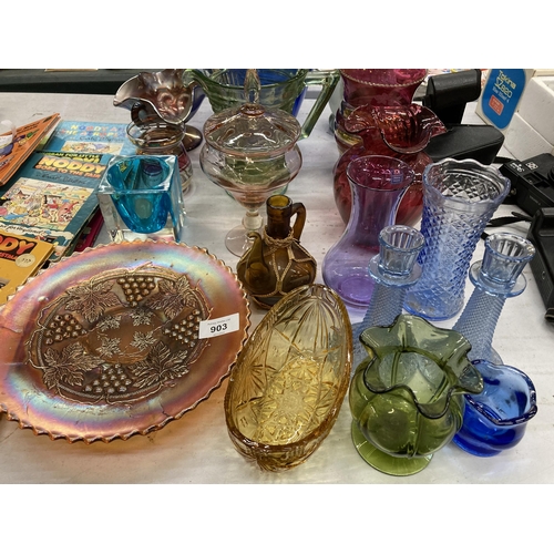 903 - A LARGE QUANTITY OF COLOURED GLASS TO INCLUDE VASES, JUGS, CANDLESTICKS, A BON BON DISH, CARNIVAL GL... 