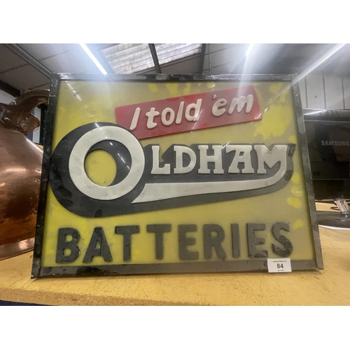 84 - AN OLDHAM BATTERIES 'I TOLD 'EM' ILLUMINATED BOX SIGN