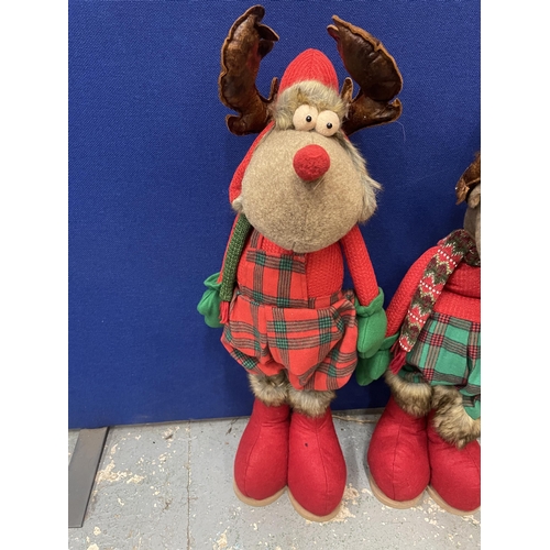 99 - A BOY AND GIRL CHRISTMAS REINDEER FIGURES