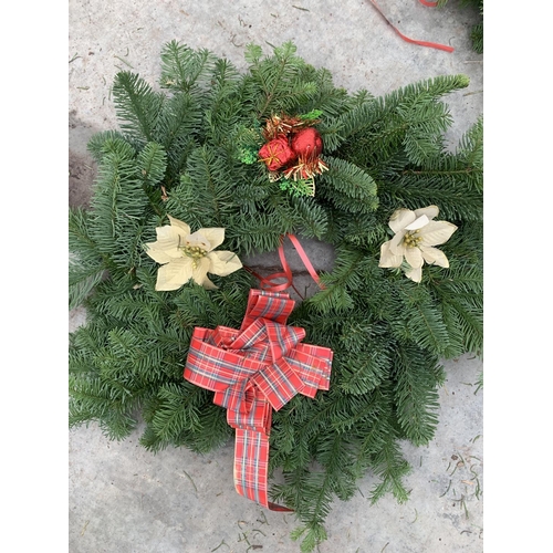 122 - FIVE LARGE WREATHS WITH POINSETTIA AND TARTAN RIBBON + VAT. TO BE SOLD FOR THE FIVE