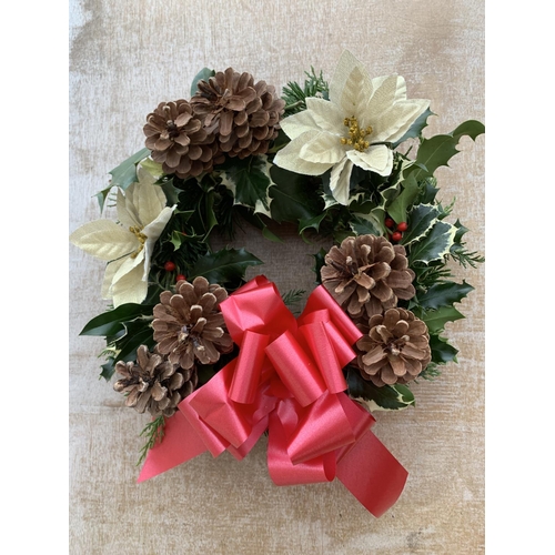 123 - FOUR WREATHS WITH CREAM POINSETTIA, CONES AND RED/BURGUNDY RIBBON + VAT. TO BE SOLD FOR THE FOUR