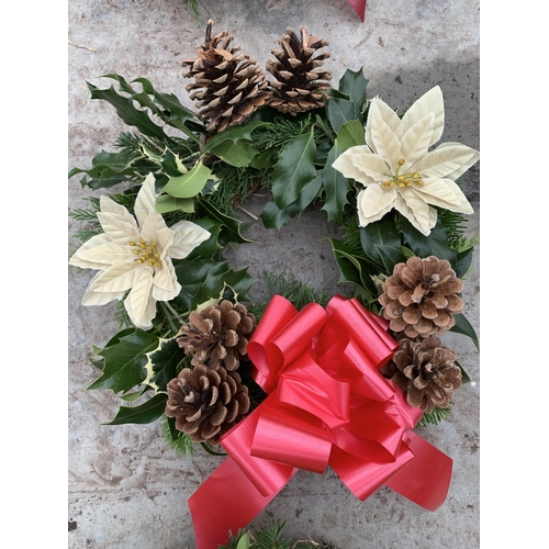 126 - FOUR WREATHS WITH CREAM POINSETTIA, CONES AND RED/BURGUNDY RIBBON + VAT. TO BE SOLD FOR THE FOUR