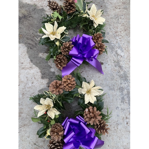 127 - FOUR WREATHS WITH CREAM POINSETTIA, CONES AND RIBBON + VAT. TO BE SOLD FOR THE FOUR