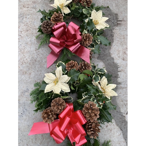 128 - FOUR WREATHS WITH CREAM POINSETTIA, CONES AND RIBBON + VAT. TO BE SOLD FOR THE FOUR